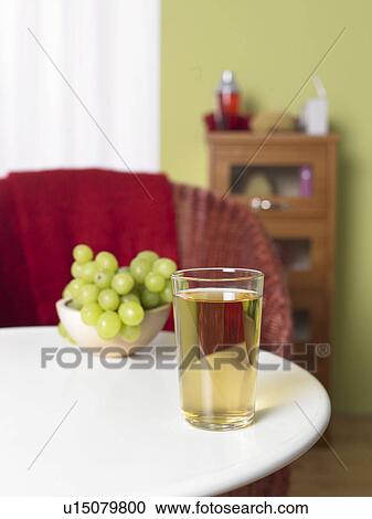 Stock Image - Glass of white grape juice. Fotosearch