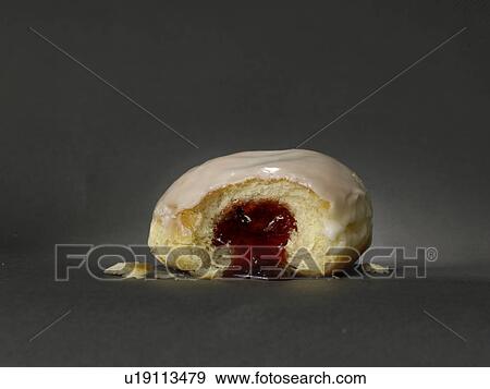 Stock Photo - Half eaten doughnut. Fotosearch