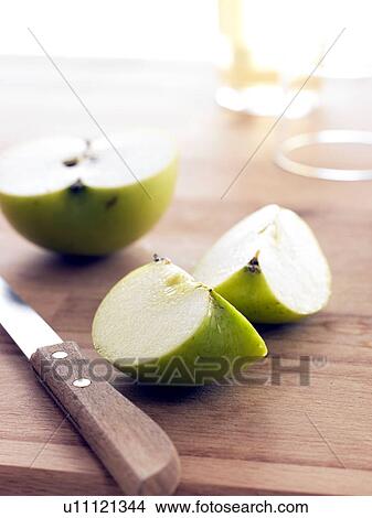 Halved and quartered apple Jonagold with knife View Large Photo Image Picture - Halved and quartered apple Jonagold with knife. Fotosearch