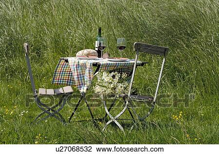 Having lunch on a summer meadow View Large Photo Image Stock Image - Having lunch on a summer meadow. Fotosearch