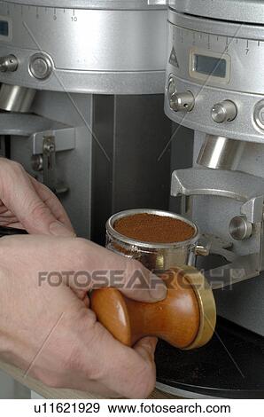 Stock Photo - Making espresso with a coffee machine. Fotosearch
