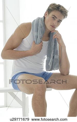 Stock Photo - Man in sportswear with a towel. Fotosearch