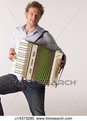 Stock Image - Man playing accordion. Fotosearch