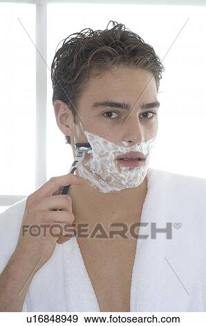 Stock Photo - Man wet shaving. Fotosearch