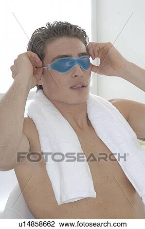 Stock Image - Man with a gel mask. Fotosearch