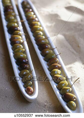 Stock Photo - Olives in a row. Fotosearch