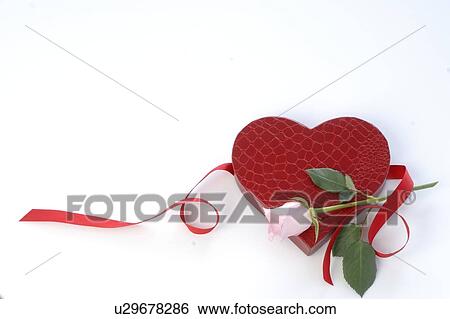 Stock Photograph - Pinkheart shaped gift box and a rose. Fotosearch