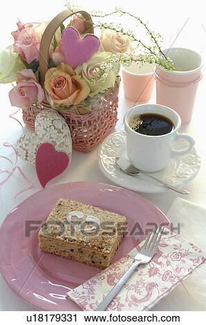 Stock Image - Place setting with coffee and cake. Fotosearch