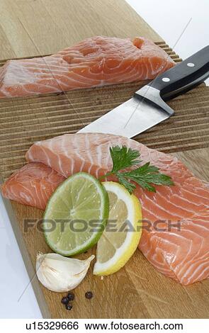 Stock Photograph - Preparing fish. Fotosearch