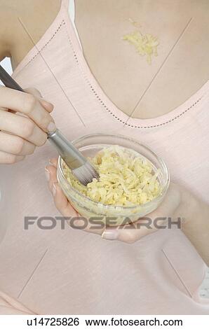 Teenage girl applying peeling to her skin View Large Photo Image Stock Photograph - Teenage girl applying peeling to her skin. Fotosearch