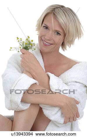 Woman in bathrobe with chamomile View Large Photo Image Picture - Woman in bathrobe with chamomile. Fotosearch