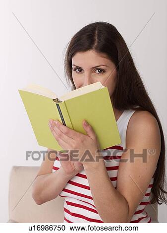 Woman reading a book View Large Photo Image Stock Image - Woman reading a book. Fotosearch