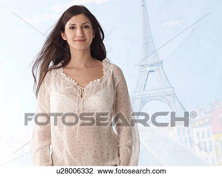 Woman with Eiffel Tower in background View Large Photo Image Stock Image - Woman with Eiffel Tower in background. Fotosearch