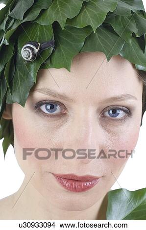 Woman with leaves and a snail on her head View Large Photo Image Picture - Woman with leaves and a snail on her head. Fotosearch