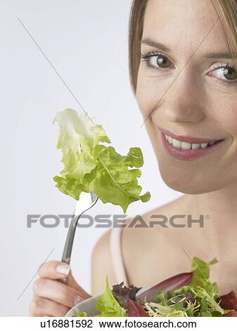Woman with salat and fork View Large Photo Image Stock Image - Woman with salat and fork. Fotosearch