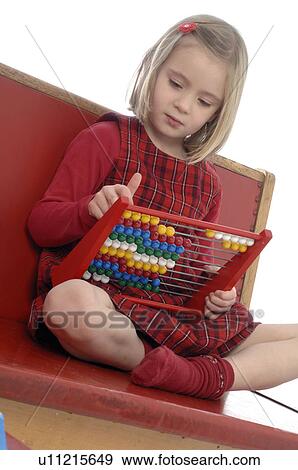 Young girl calculating with abacus View Large Photo Image Stock Photo - Young girl calculating with abacus. Fotosearch