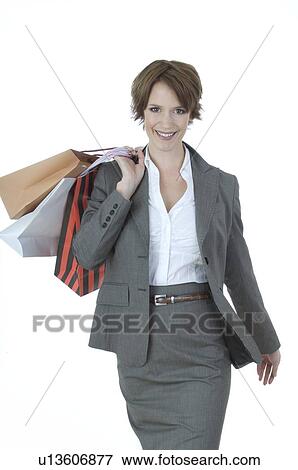 Stock Photo - Young woman shopping in business dress. Fotosearch
