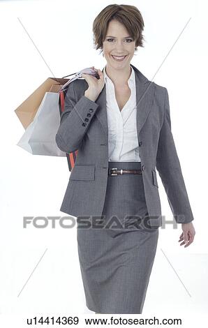 Young woman shopping in business dress View Large Photo Image Stock Photo - Young woman shopping in business dress. Fotosearch
