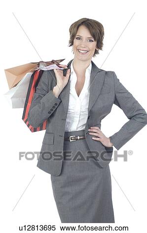 Stock Photography - Young woman shopping in business dress. Fotosearch