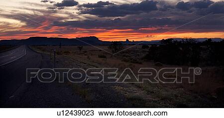 Asphalt road leading into dramatic sunset, with wild sage along roadside, and grey-pink-orange sky at twilight, Utah View Large Photo Image Stock Image - Asphalt road leading into dramatic sunset, with wild sage along roadside, and grey-pink-orange sky at twilight, Utah. Fotosearch