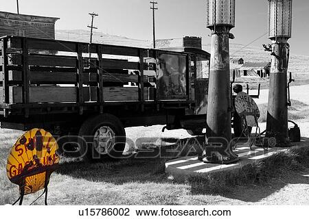 Desaturated image of gas station with antique truck parked at petrol pumps, with yellow original metal sign, Bodie pioneer village, California View Large Photo Image Stock Image - Desaturated image of gas station with antique truck parked at petrol pumps, with yellow original metal sign, Bodie pioneer village, California. Fotosearch
