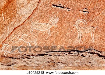 Stock Photo - Detail of etched petroglyphs at Buckhorn Draw, Utah showing rock with depictions of rams and goats. Fotosearch