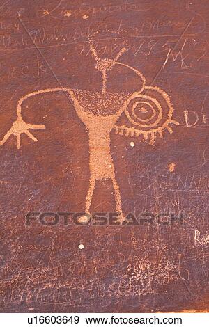Detail of etched petroglyphs at Buckhorn Draw, Utah, showing rock with depictions of figure standing with symbol beside. View Large Photo Image Stock Photo - Detail of etched petroglyphs at Buckhorn Draw, Utah, showing rock with depictions of figure standing with symbol beside.. Fotosearch