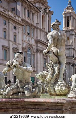 Stock Photo - Fontana del Moro, Piazza Navona, with church of Sant'Agnese in Agone beyond, on sunny summer day.. Fotosearch