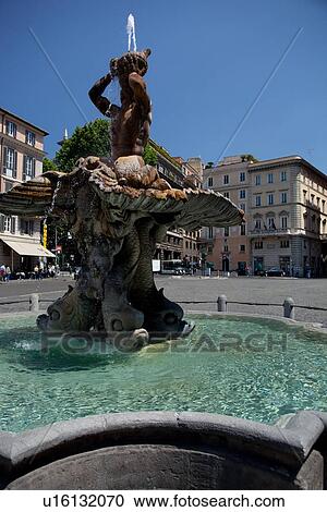 Stock Image - Fountain of Triton, Piazza Barberini on sunny summer day. Fotosearch