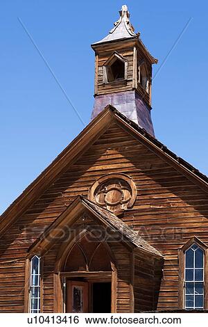Front detail of wooden church, doorway, windows and wooden spire, against blue summer morning sky, Bodie pioneer village, California View Large Photo Image Stock Photograph - Front detail of wooden church, doorway, windows and wooden spire, against blue summer morning sky, Bodie pioneer village, California. Fotosearch