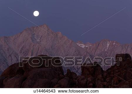 Full moon setting over snow-tipped High Sierras mountain range, pre-dawn View Large Photo Image Stock Image - Full moon setting over snow-tipped High Sierras mountain range, pre-dawn. Fotosearch