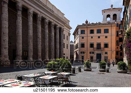 Stock Photography - Hadrian's Temple, Rome, piazza and restaurant, with stucco baroque building and loggia, in piazza. Fotosearch