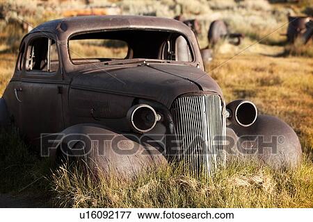 Stock Photo - Old car abandoned in field, front side view, Bodie pioneer village, California. Fotosearch