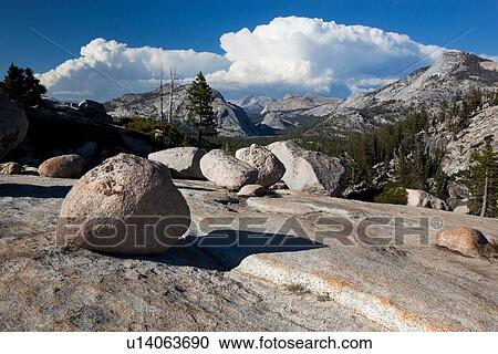 Panorama at Olmsted Point with erratics in foreground along granite ridge, and blue summer afternoon sky, with dramatic cloud formation, Yosemite View Large Photo Image Stock Image - Panorama at Olmsted Point with erratics in foreground along granite ridge, and blue summer afternoon sky, with dramatic cloud formation, Yosemite. Fotosearch