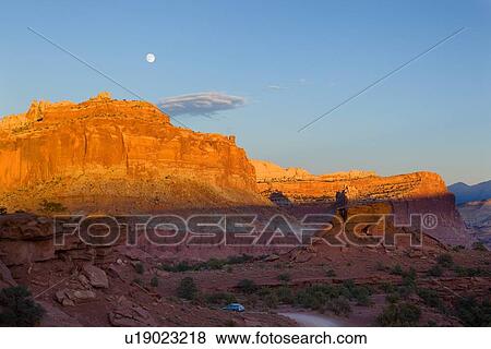 Panorama at Panorama Point, Utah, sunset light on red mountain rock, winding road, with full moon rising, View Large Photo Image Stock Photo - Panorama at Panorama Point, Utah, sunset light on red mountain rock, winding road, with full moon rising,. Fotosearch