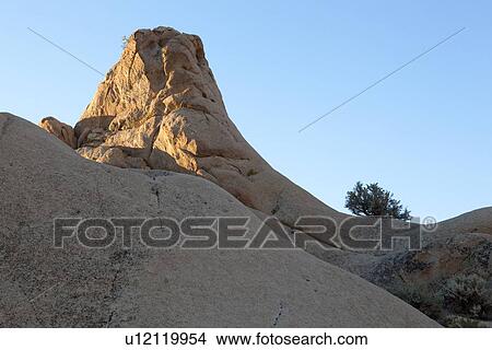 Picture - Sandstone buttes near Buttermilk Rd. in post-dawn summer light, against blue sky. Fotosearch
