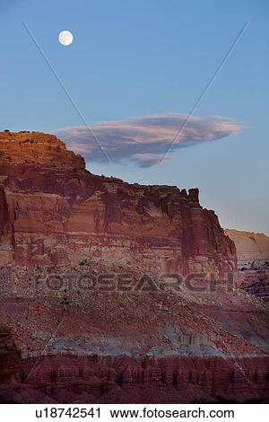 View at Panorama Point, Utah, sunset light on red mountain rock, pink-grey cloud in blue sky, with full moon rising, View Large Photo Image Stock Image - View at Panorama Point, Utah, sunset light on red mountain rock, pink-grey cloud in blue sky, with full moon rising,. Fotosearch