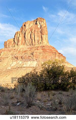 Stock Photo - View of Bottleneck Mountain, San Rafael Swell on sunny fall morning with blue sky and puffy white clouds, Buckhorn Draw, Utah. Fotosearch