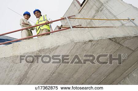 Architect and construction manager on site View Large Photo Image Stock Photography - Architect and construction manager on site. Fotosearch