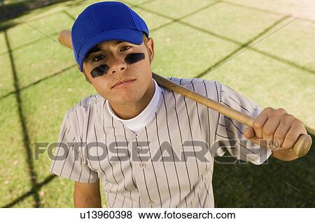 Baseball player with eye black, holding baseball bat on shoulder, (portrait), (elevated view) View Large Photo Image Stock Photo - Baseball player with eye black, holding baseball bat on shoulder, (portrait), (elevated view). Fotosearch