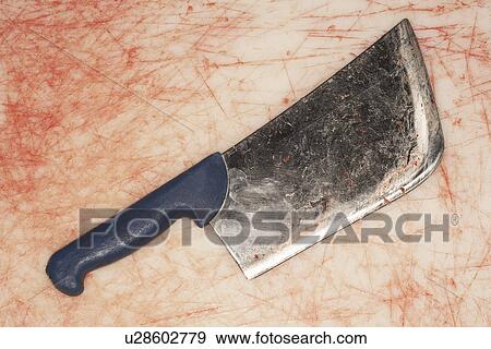 Bloody Cleaver on Stained Countertop, view from above View Large Photo Image Stock Photo - Bloody Cleaver on Stained Countertop, view from above. Fotosearch