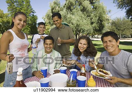 Picture - Boy (13-15) with family at picnic.. Fotosearch