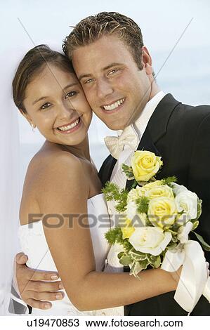 Bride and Groom embracing outdoors, (portrait) View Large Photo Image Stock Image - Bride and Groom embracing outdoors, (portrait). Fotosearch
