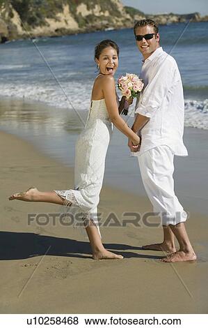 Bride and Groom on beach, (portrait) View Large Photo Image Stock Photo - Bride and Groom on beach, (portrait). Fotosearch