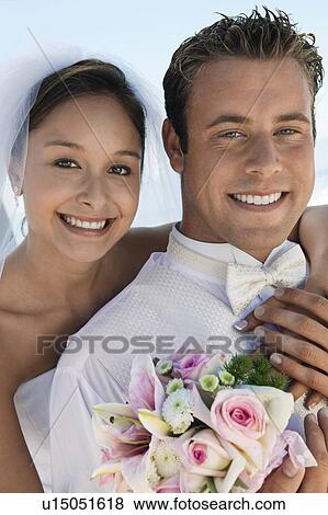 Bride and Groom with bouquet, outdoors, (close-up), (portrait) View Large Photo Image Stock Photo - Bride and Groom with bouquet, outdoors, (close-up), (portrait). Fotosearch