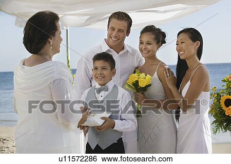 Bride and Groom with family at beach wedding View Large Photo Image Stock Photograph - Bride and Groom with family at beach wedding. Fotosearch