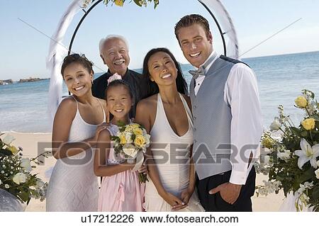 Bride and Groom with family on beach, (portrait) View Large Photo Image Stock Photograph - Bride and Groom with family on beach, (portrait). Fotosearch