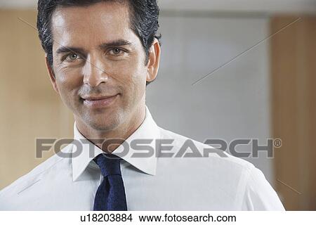 Picture - Businessman smiling, portrait. Fotosearch