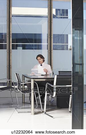 Picture - Businessman working in conference room. Fotosearch