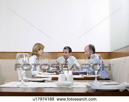 Businesspeople in restaurant View Large Photo Image Stock Photo - Businesspeople in restaurant. Fotosearch